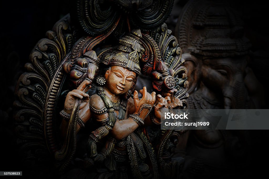 Hindu Lord Krishna Wooden statue of Lord Krishna God Stock Photo