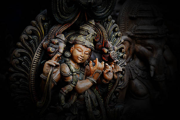 Hindu Lord Krishna Wooden statue of Lord Krishna buddha photos stock pictures, royalty-free photos & images