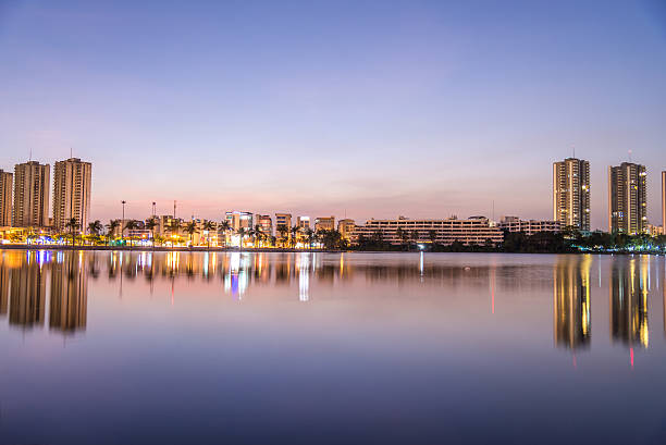 istock Riverside buildings with blue sky and rainbow. 537538952