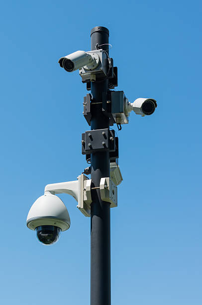 istock Surveillance cameras on a post on the street 537540420