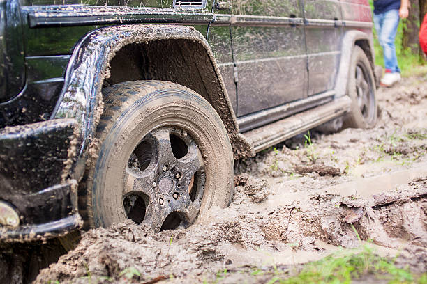istock SUV got stuck in the mud in the forest, off-road 537544068