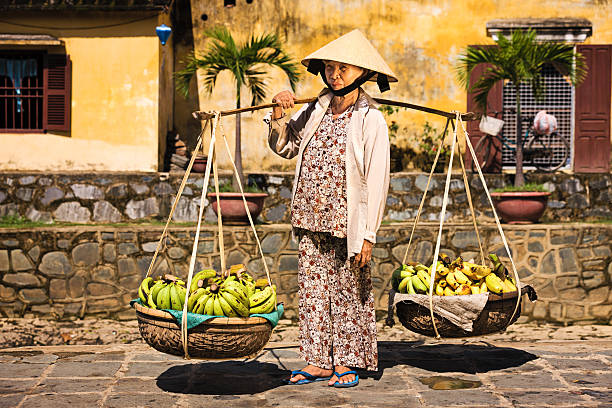 istock Vietnamese woman selling bananas in Hoi An 537544310