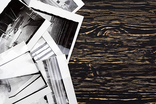 istock Black and white photos on wooden table background. 537545212