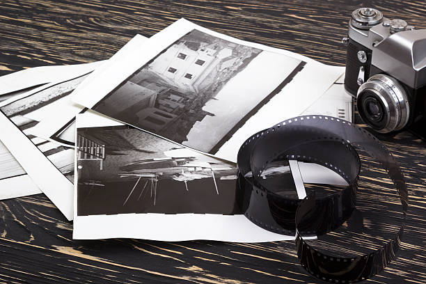 istock retro camera, film and some old photos 537545468