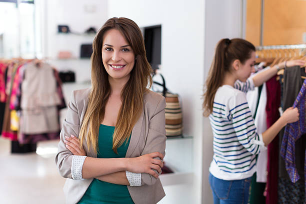 istock Sales assistant in clothing store 537545930