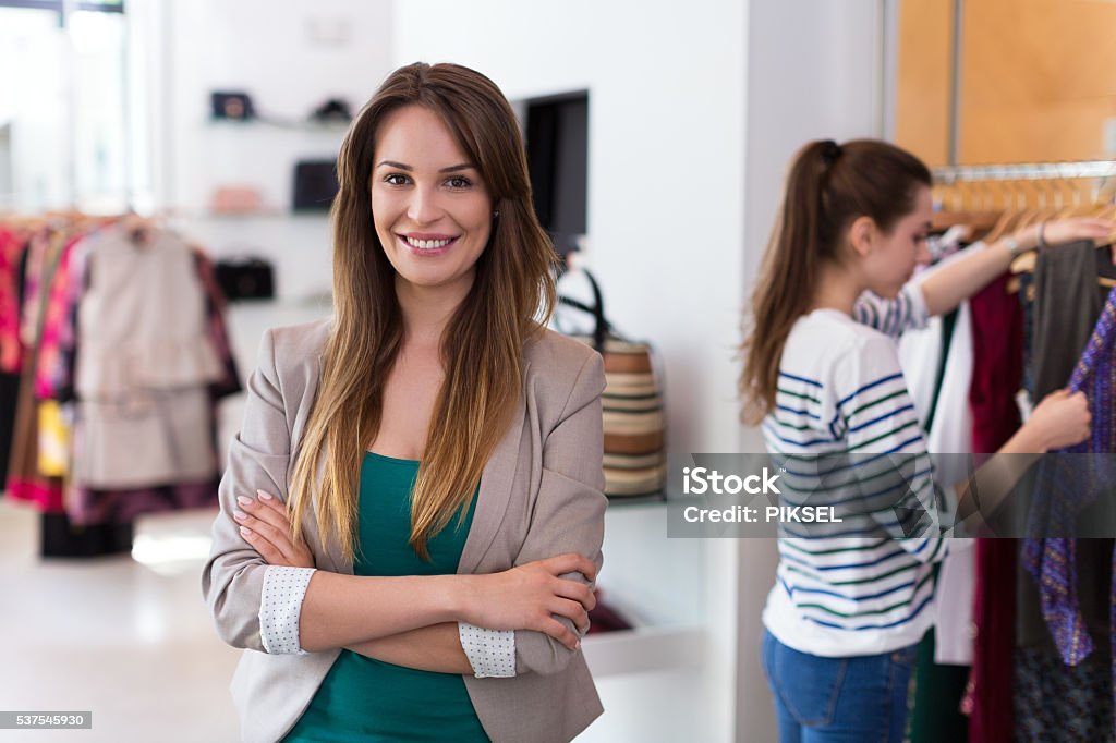 Sales assistant in clothing store Clothing Stock Photo