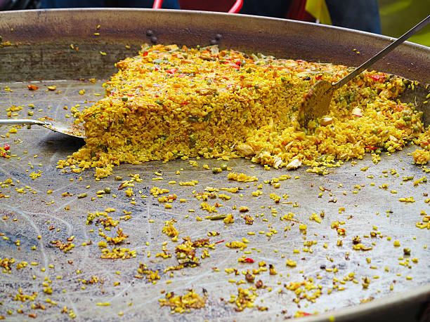 istock Paella on giant frying pan done at the carnival 537546392