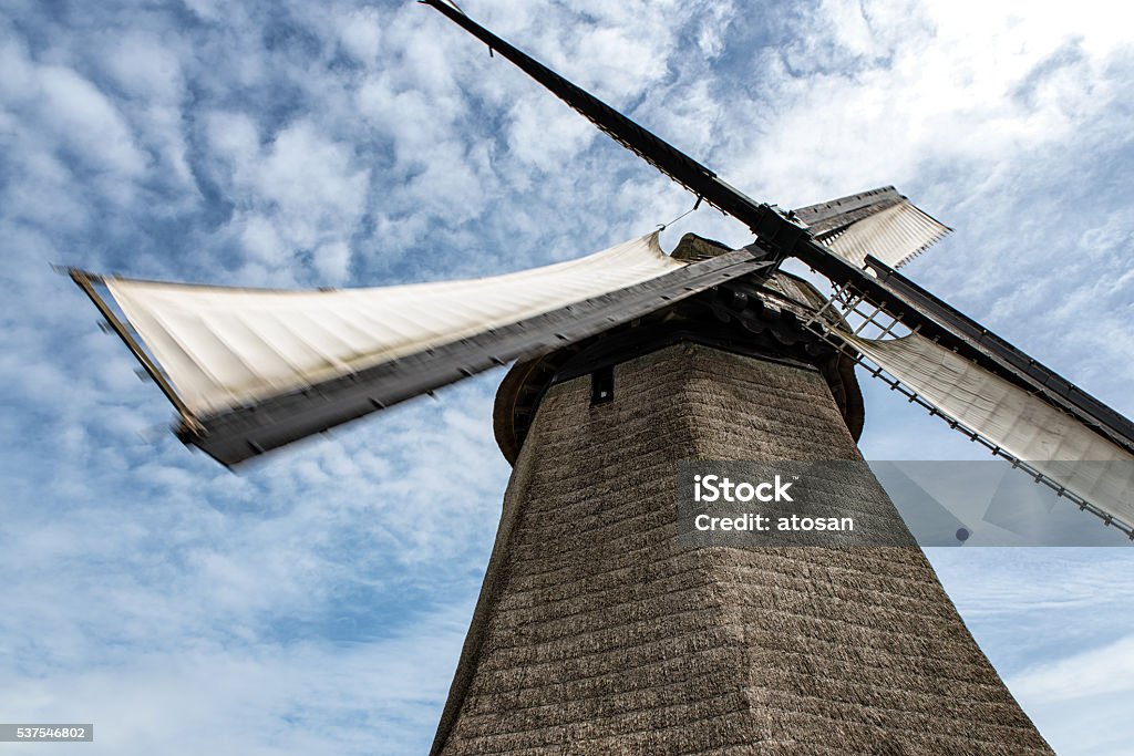 Traditional Dutch Windmill A close up perspective on a Dutch Windmill. Brick Stock Photo