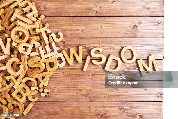 Word Wisdom Made With Wooden Letters Stock Photo - Download Image Now - Abstract, Alphabet, At The Edge Of