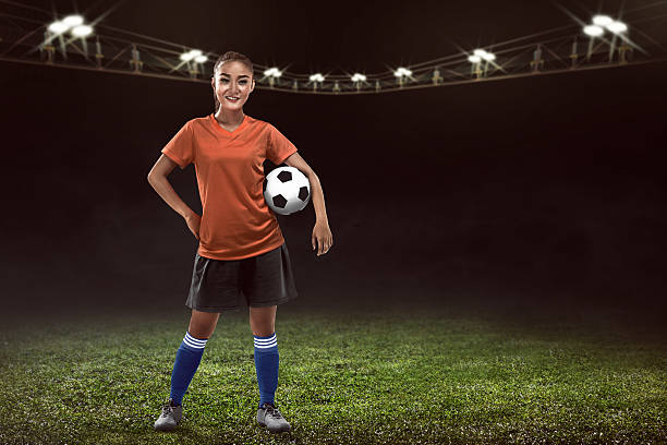 istock Woman holding soccer ball 537548456