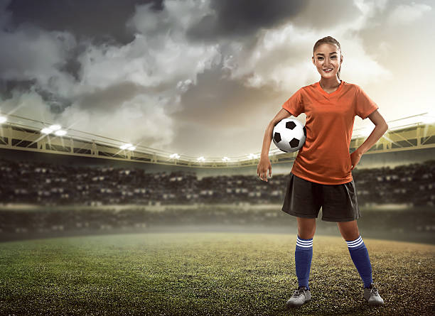 istock Woman holding soccer ball 537548810