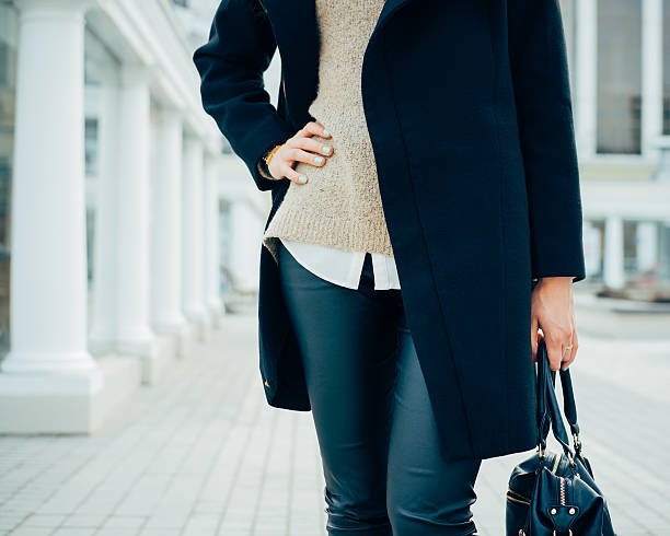 istock Woman in an elegant coat holding a handbag 537549158