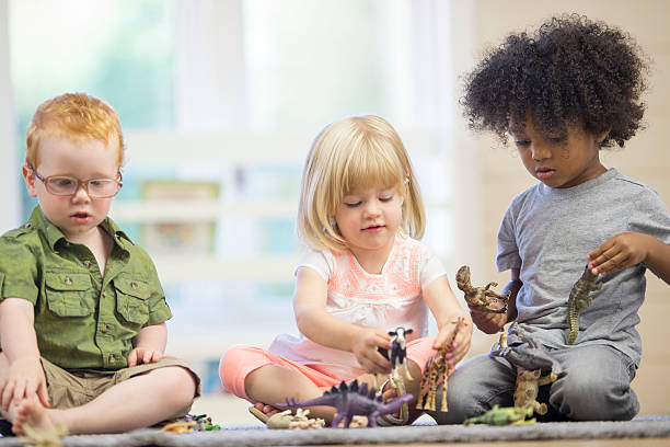 istock Toddlers Playing with Animal Toys 537549662
