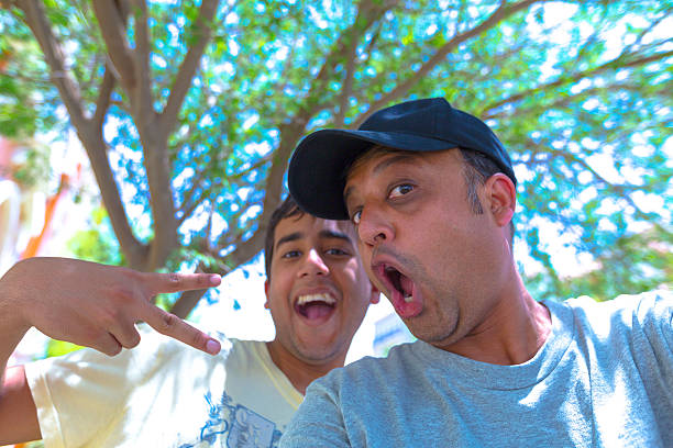 istock Father and Son having fun with the camera 537550356