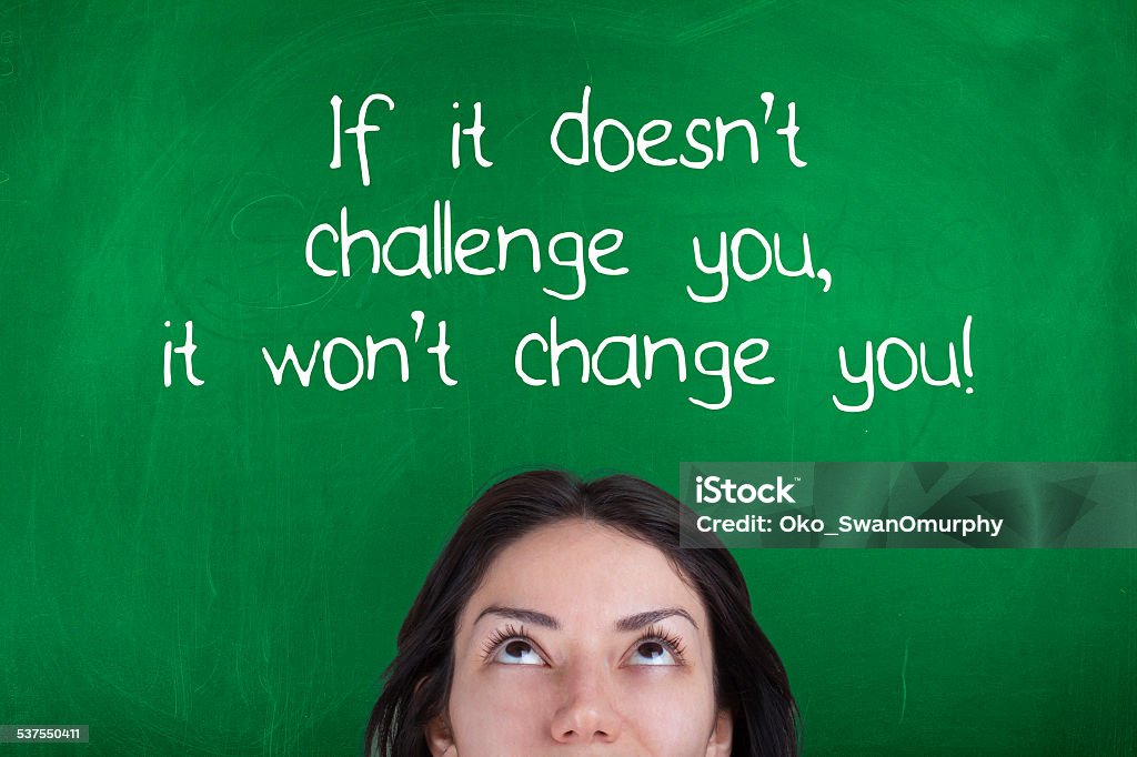 If It Doesn't Challenge You It Won't Change You Motivational phrase over female head Quotation - Text Stock Photo