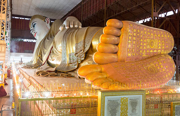 Shwethalyaung Reclining Buddha in Bago, Myanmar (Burma) seen from foot end. The Buddha statue is 55 m long. Originally built 994, lost rediscovered and restored.