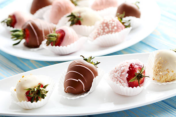 istock Strawberries covered in chocolate on a blue wooden table 537551790