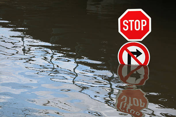 Floods in Usti nad Labem, Czech Republic. Stop and No right turn, traffic signs flooded by the swollen Elbe River in Usti nad Labem, Northern Bohemia, Czech Republic, on June 5, 2013. stop single word stock pictures, royalty-free photos & images