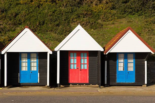 istock Light green beach huts traditional English structure and shelter 537552509