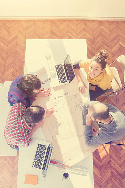 istock Young group of people/architects discussing business plans 537552899