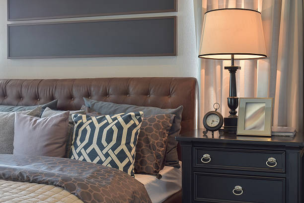 istock Cozy bedroom interior with pillows and reading lamp 537553000