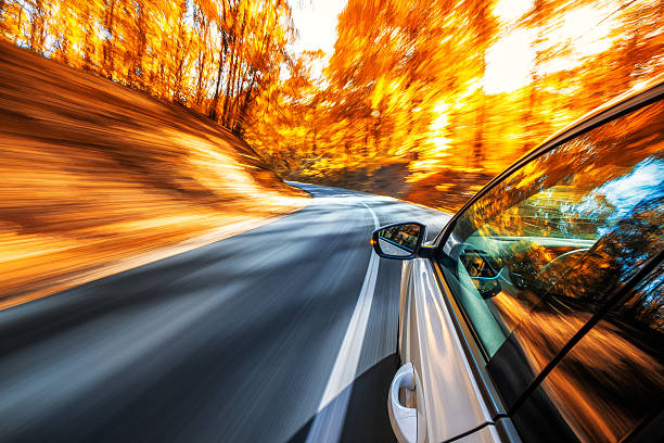Driving in the fall stock photo