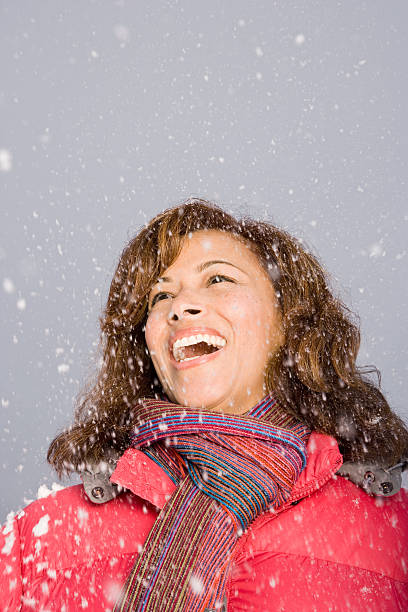 istock Woman laughing in the snow 537554355