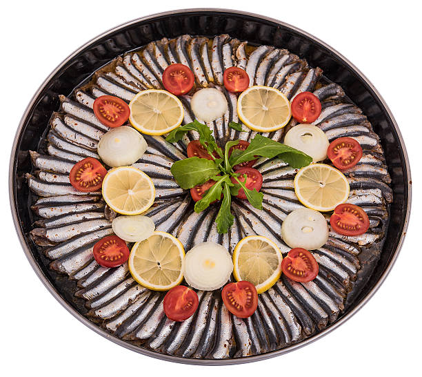 anchovy fish preparation on oven pan stock photo