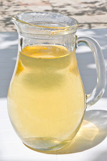 White wine Glass jar of White wine on the table feeding grapes stock pictures, royalty-free photos & images