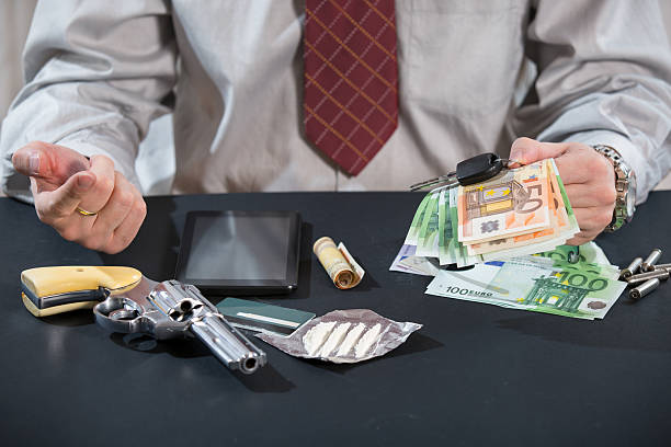 istock Man With Gun, Money, Drugs 537581189