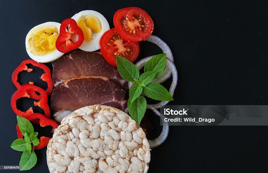 Ingredients for a sandwich. Meat, egg, tomato, onion, pepper, basil Ingredients for a sandwich. Meat, egg, tomato, onion, pepper, basil. 2015 Stock Photo