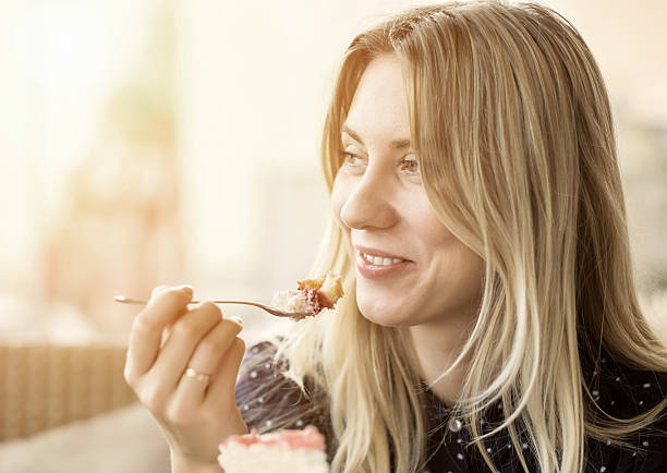 istock Happiness female with cake under sunlight 537585099