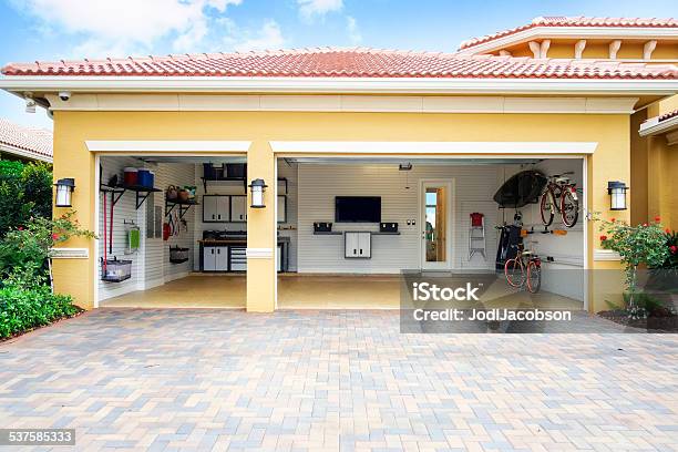 Well Organized Clean Three Car Residential Garage Stock Photo - Download Image Now - Garage, Organization, Residential Building