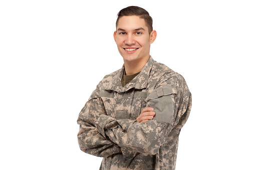 Happy soldier with arms crossed