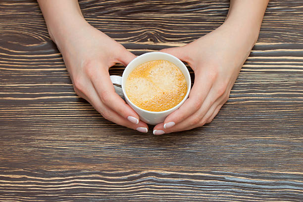 istock cup of coffee in hand 537585977