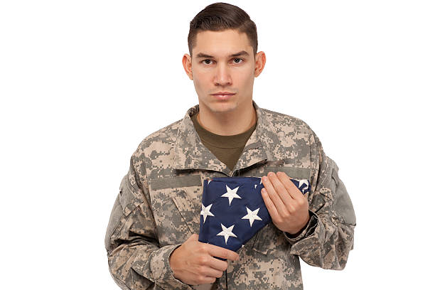 istock Soldier with American flag 537585979