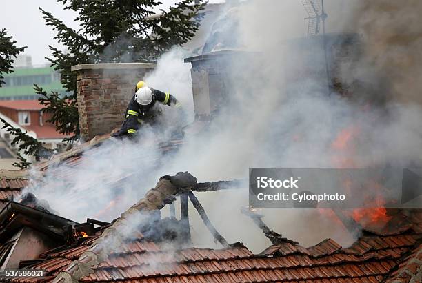 Firefighters Burning House Stock Photo - Download Image Now - 2015, Accidents and Disasters, Beat The Clock
