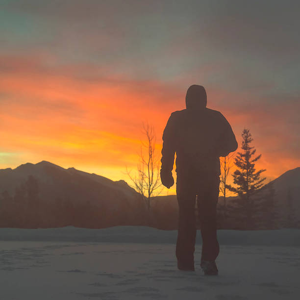 istock Man walks through spindrift snow, sunrise 537586707