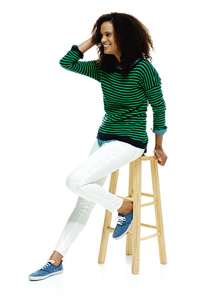 istock Happy woman sitting on stool 537586913