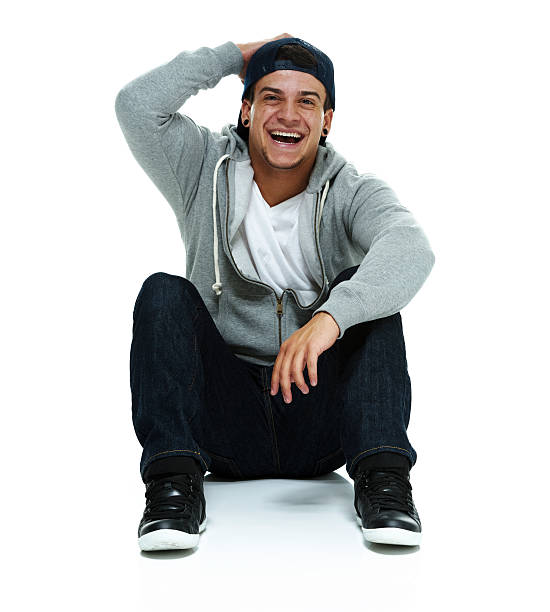 istock Cheerful man on floor & looking at camera 537587125