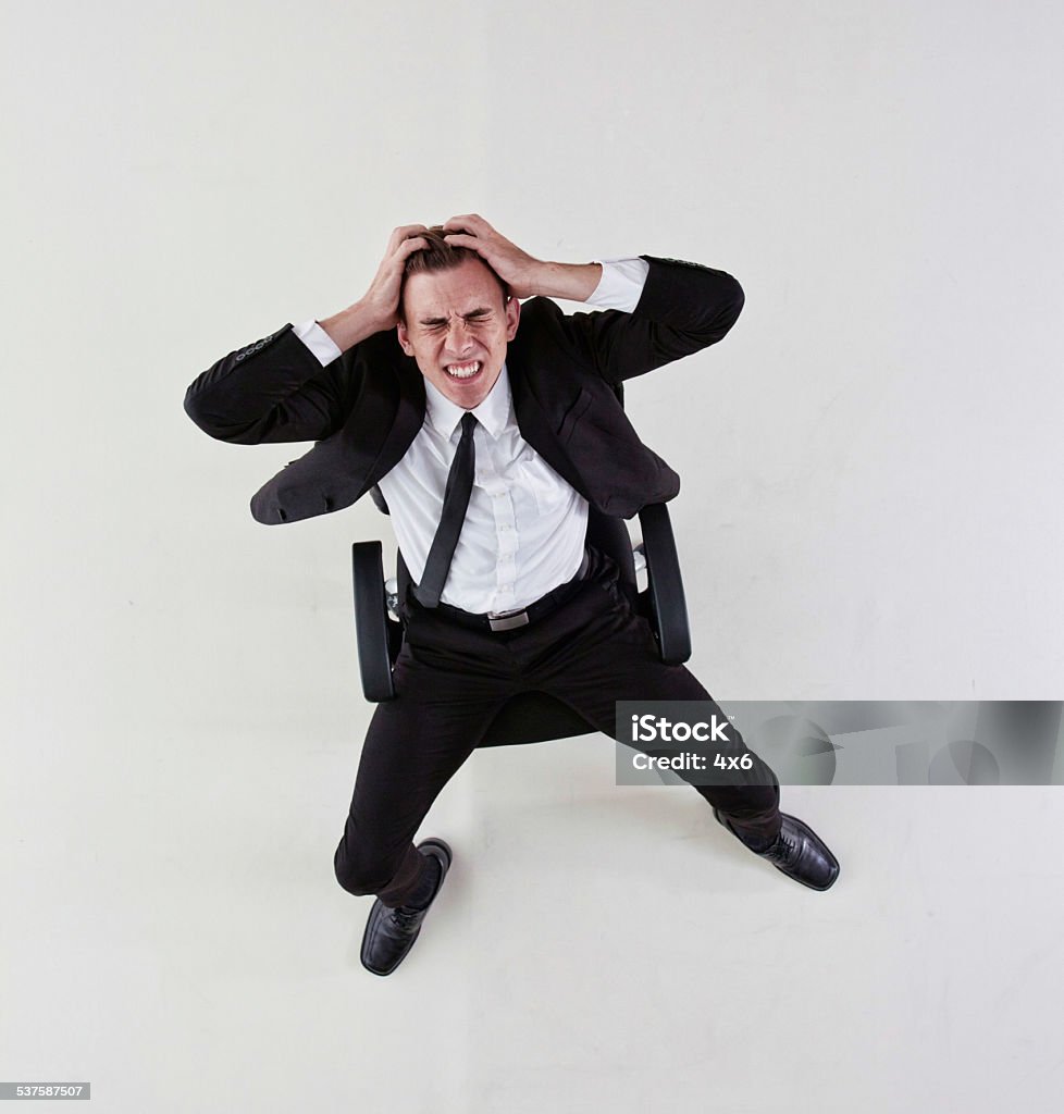 Businessman sitting on the chair stressed out Businessman sitting on the chair stressed outhttp://www.twodozendesign.info/i/1.png 20-24 Years Stock Photo