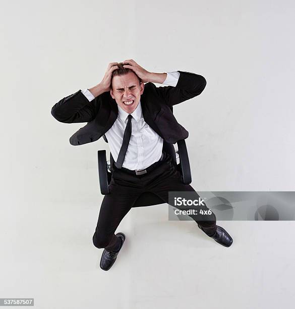 Businessman Sitting On The Chair Stressed Out Stock Photo - Download Image Now - 20-24 Years, 20-29 Years, 2015