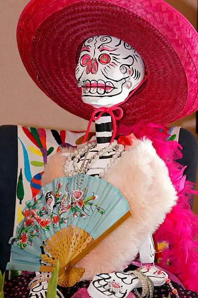 A traditional decoration for the holiday "Dia De Los Muertos" or Day of the Dead.  This skull is finely dressed and ready to honor the passing of friends and family for this festive celebration.