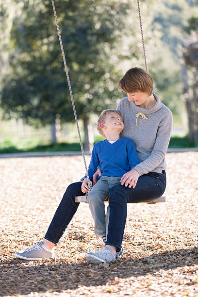 istock family at swings 537594097