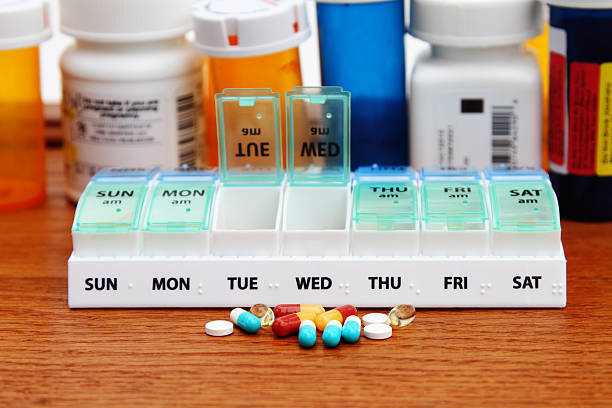 istock Medicine pill box daily planner with prescription bottles 537595009