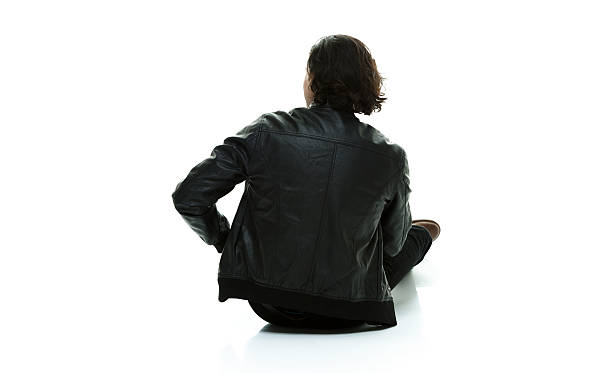 istock Rear view of casual man sitting on floor 537596217