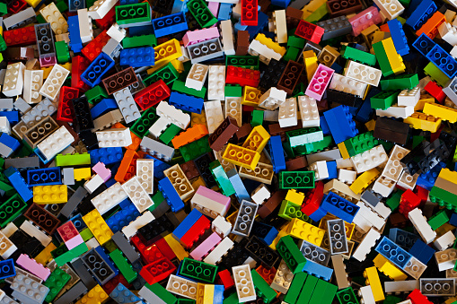 Copenhagen, Denmark - February 14, 2015: Color photo of a big pile of colorful Lego bricks. The photo is taken in a toy shop in Copenhagen. The Lego bricks fill the entire photo.