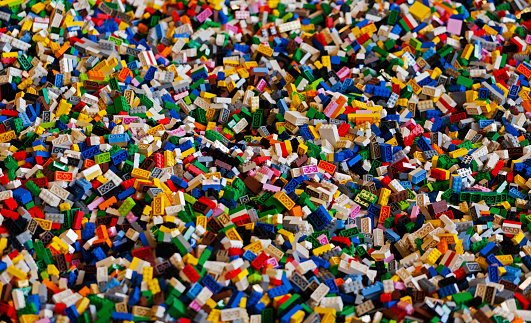 Copenhagen, Denmark - February 14, 2015: Color photo of a big pile of colorful Lego bricks. The photo is taken in a toy shop in Copenhagen. The Lego bricks fill the entire photo.