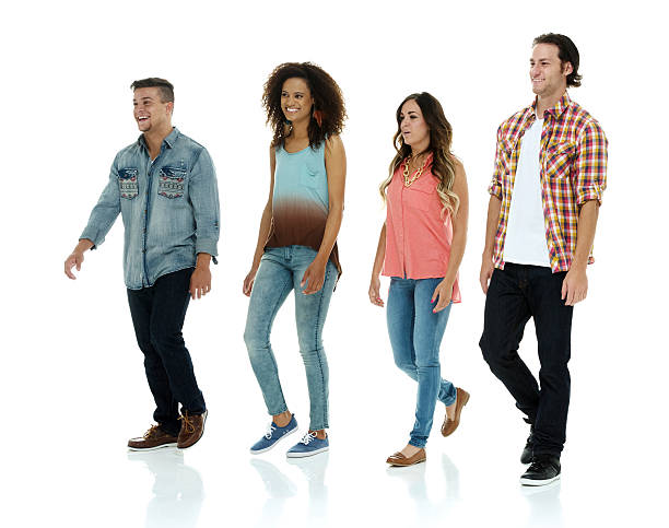 istock Smiling four people walking together 537596893