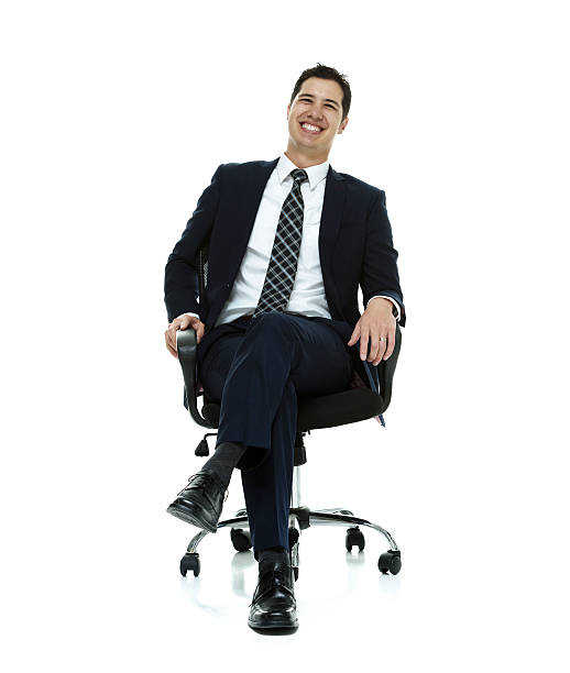istock Cheerful businessman on chair & looking at camera 537596921